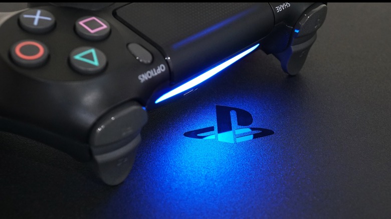 DualShock controller on top of a PS4