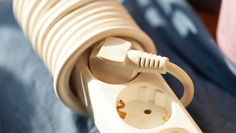 Power strip with cord coiled around it