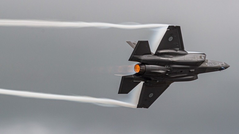 An F-35 fight jet performing an evasion maneuver