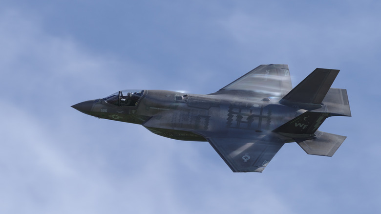 F-35 flying on a blue backdrop