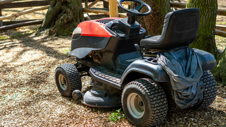 A residential lawn mower with a stamped deck