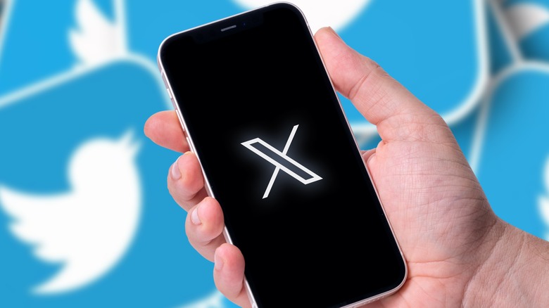 X logo on phone, Twitter old logo in background