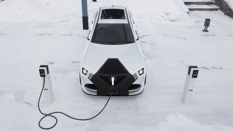 Electric car charging in snow