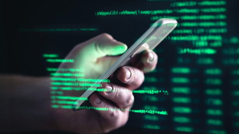 A person on a phone surrounded by green text,