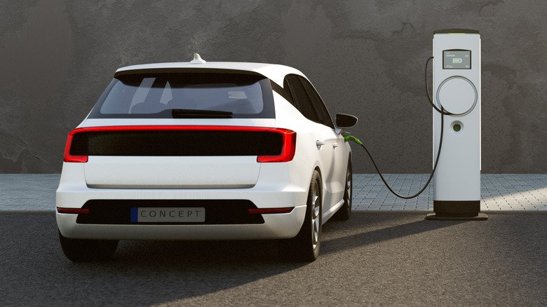 An electric car plugged in power