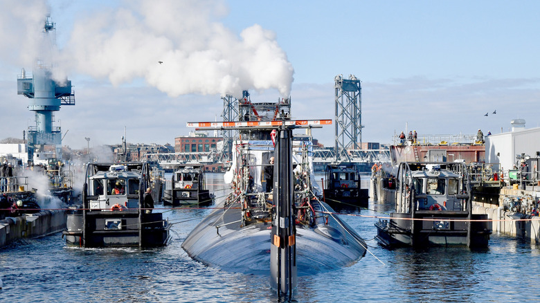 A Virginia class submarine undergoing maintenance at a dry dock.