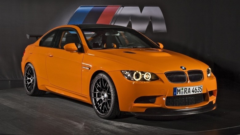 Front 3/4 static shot of BMW BMW M3 GTS with BMW M logo in the background