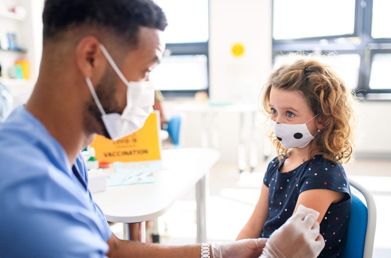 Child receiving COVID-19 vaccination 