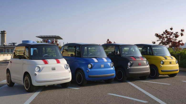 Front 3/4 view of Fiat Topolino Sport Special Edition models in various colors