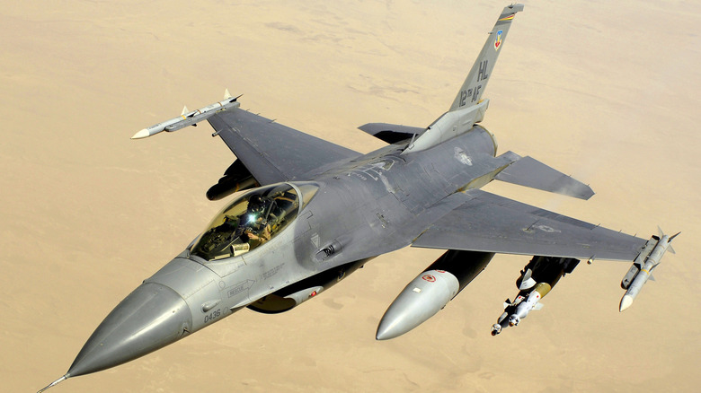 F-16 Fighting Falcon seen from above left on aptrol above a desert