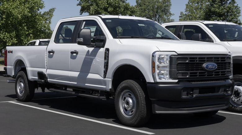 White Ford F-350 SRW 4X4 Crew Cab sits in a parking lot