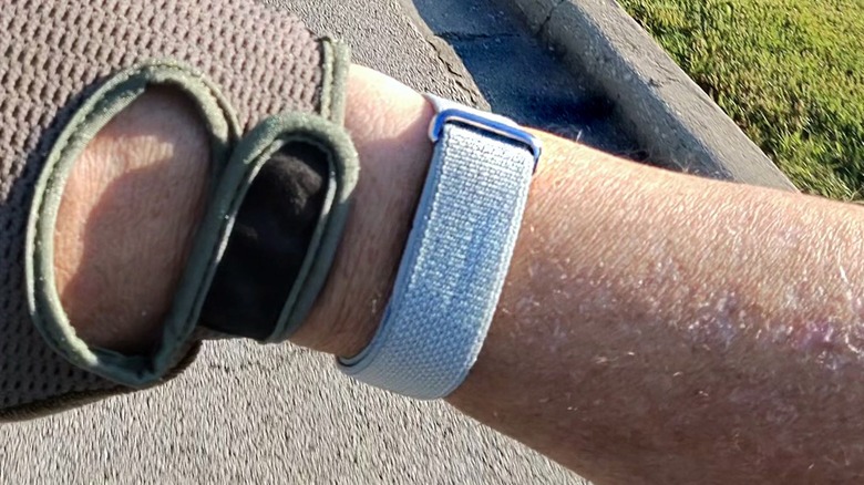 Man holding the Fitbit Air