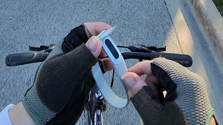 Man holding the Fitbit Air