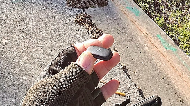 Man holding the Fitbit Air