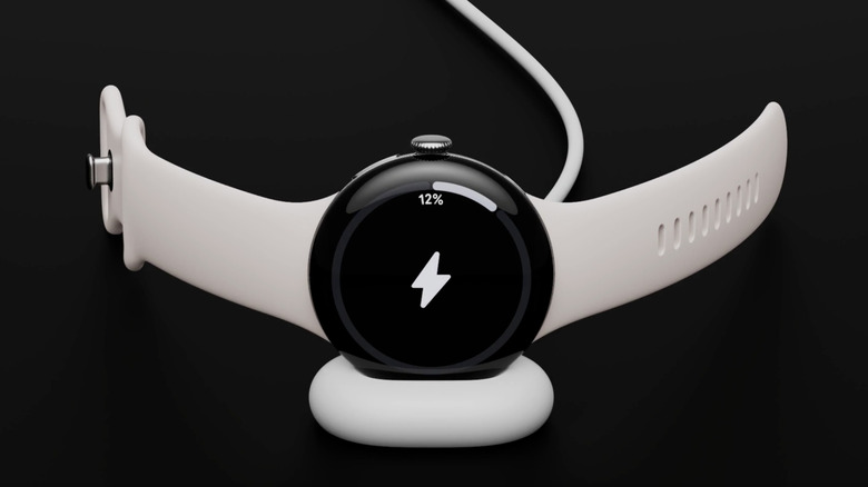 The Pixel Watch 4 charges against a black backdrop