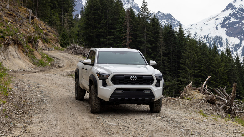 A 2024 Toyota Tacoma TRD being driven off-road