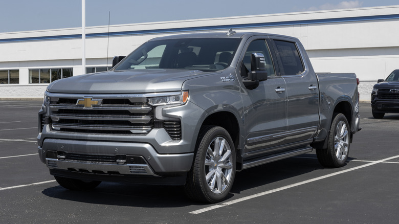 A gray Chevrolet Silverado 1500 parked in an empty parking lot.
