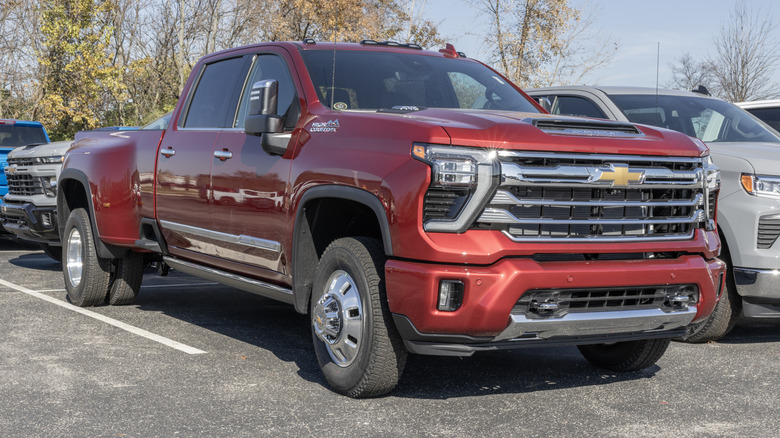 A red Chevrolet Silverado 3500 parked in a dealership car park.