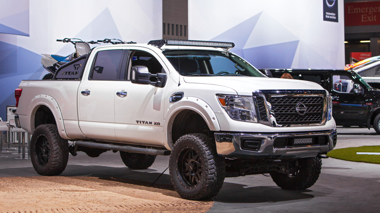 A white Nissan Titan XD truck showcased at the Chicago Motor Show.