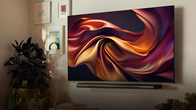 A Vizio TV hanging on the wall displaying an abstract image