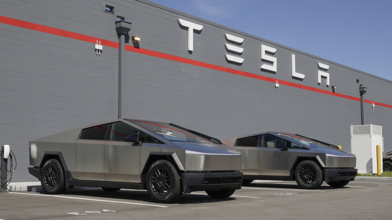 Cybertrucks parked outside Tesla dealership.