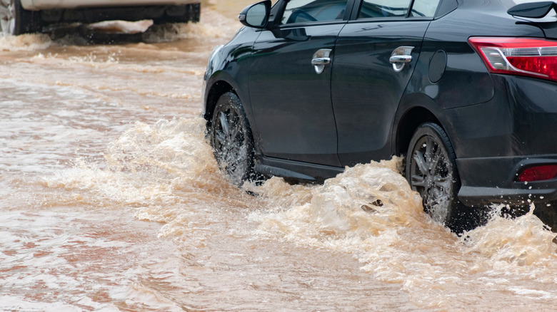 A car attempting to drive through high water