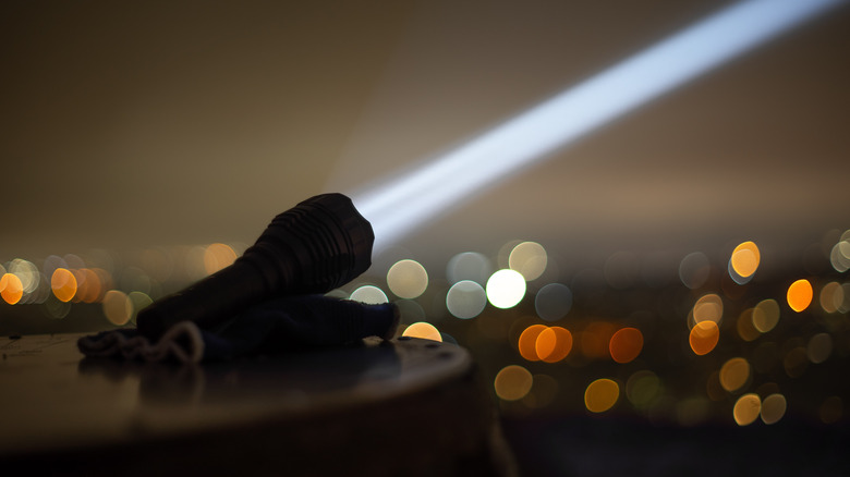 A flashlight projecting a focused beam.