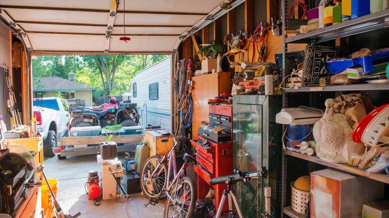 A messy, cluttered garage filled with tools and other belongings