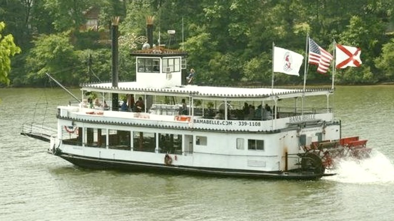 The Bama Belle Riverboat moving down the river