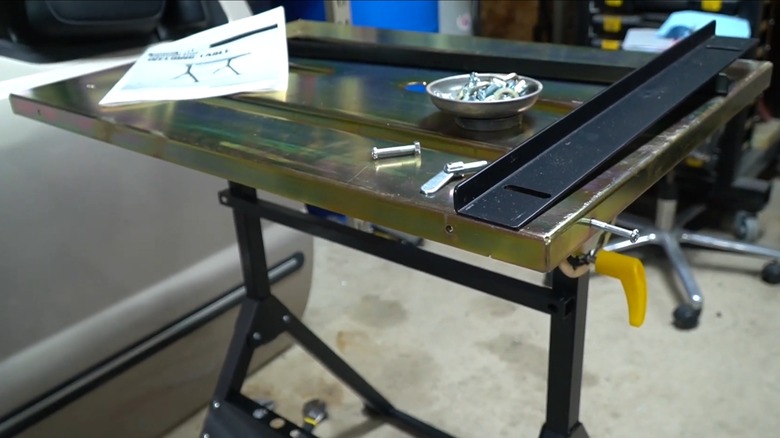 A Chicago Electric welding table in a workshop.