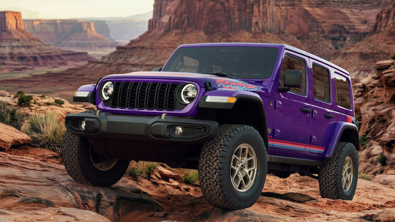 Front 3/4 view of Jeep Wrangler in off-road setting