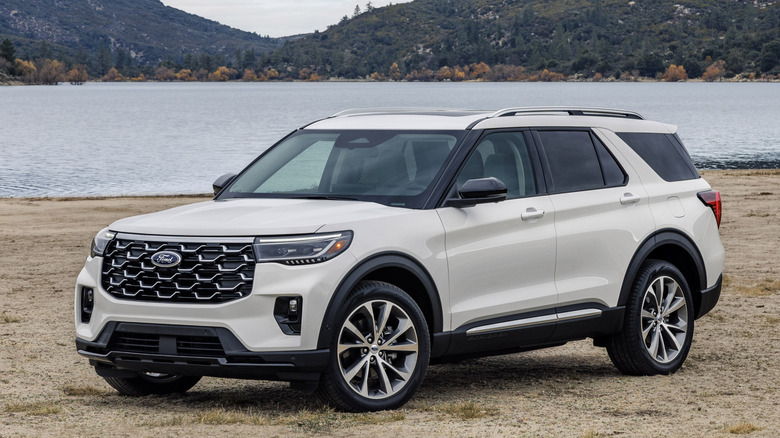 Front 3/4 view of 2025 Ford Explorer by a lake