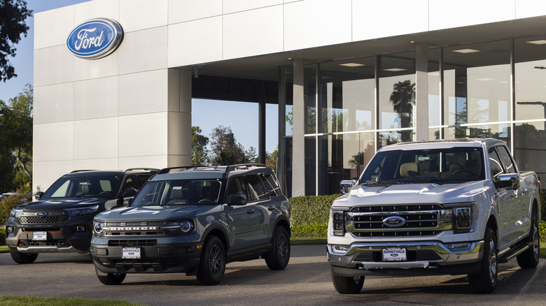 Cars parked outside a Ford dealership