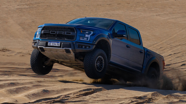 Ford F-150 Raptor jumping sand dune