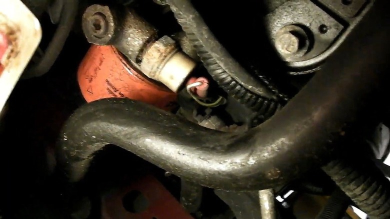 The oil filter(orange) location underneath the 1996 Ford Thunderbird