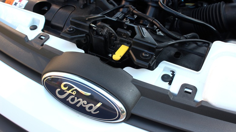 A Ford vehicle with the hood open 