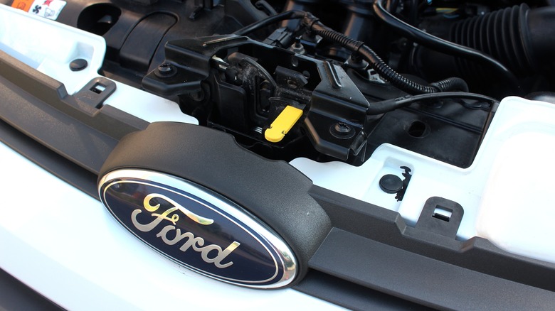 A Ford vehicle with the hood open