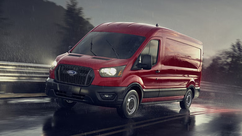 Ford Transit Cargo Van driving on a rainy road
