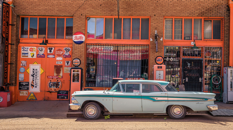 1958 Ford Edsel in front of a service station
