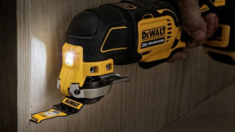 Person cutting door frame with DeWalt 20V Max XR Oscillating Multitool