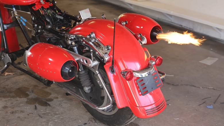 The jet-powered Harley-Davidson showing flames shooting out of one of the jet engines after startup