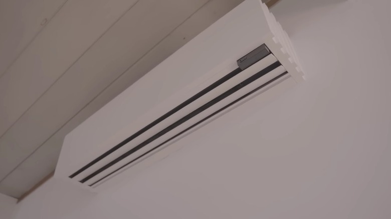 A Quilt unit installed on the wall of a home.