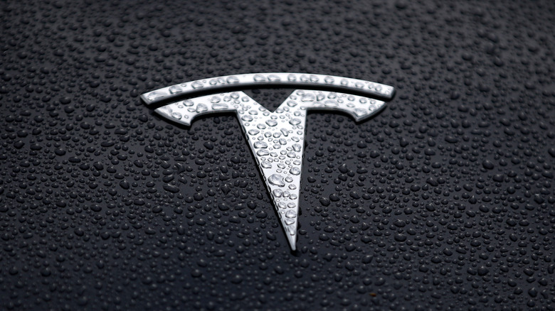 Tesla logo car water drops