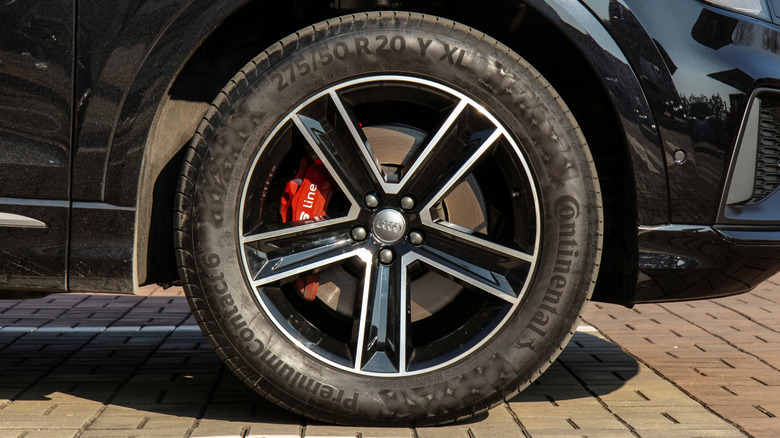 A close-up of an Audi SUV wearing Continental tires.