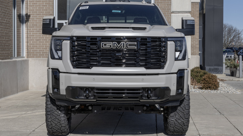 A front-end view of a gray tuned GMC Sierra.