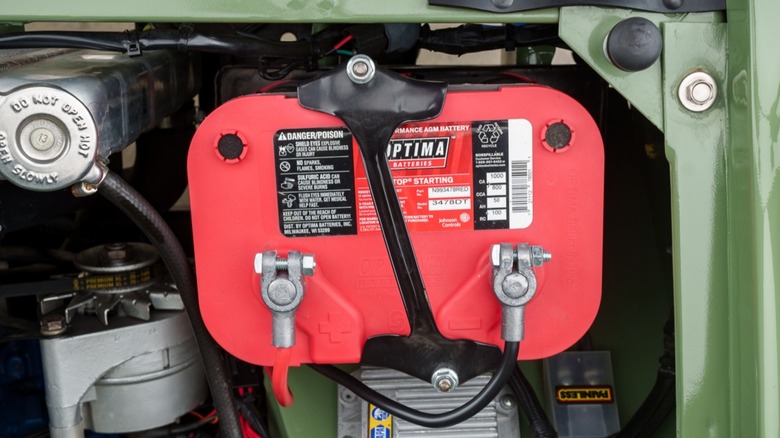 A 1970s Ford Bronco engine bay showcasing an Optima RedTop AGM battery.