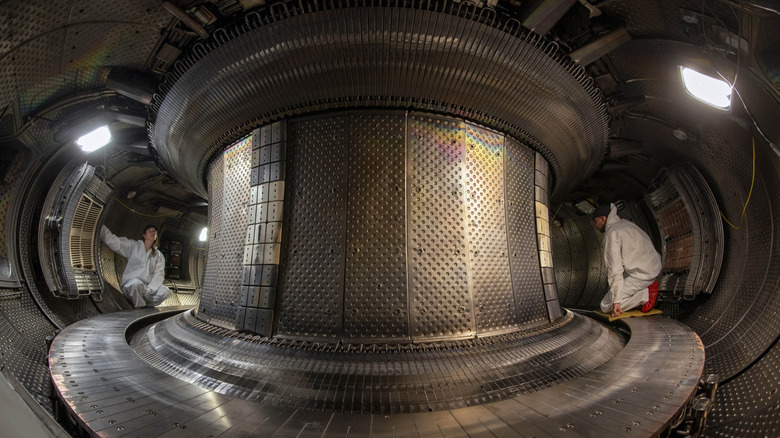 Inside of the WEST Tokamak as engineers run inspections.