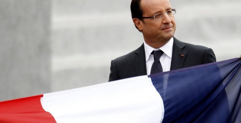 France's President Francois Hollande leaves after the traditional Bastille Day military parade in Paris