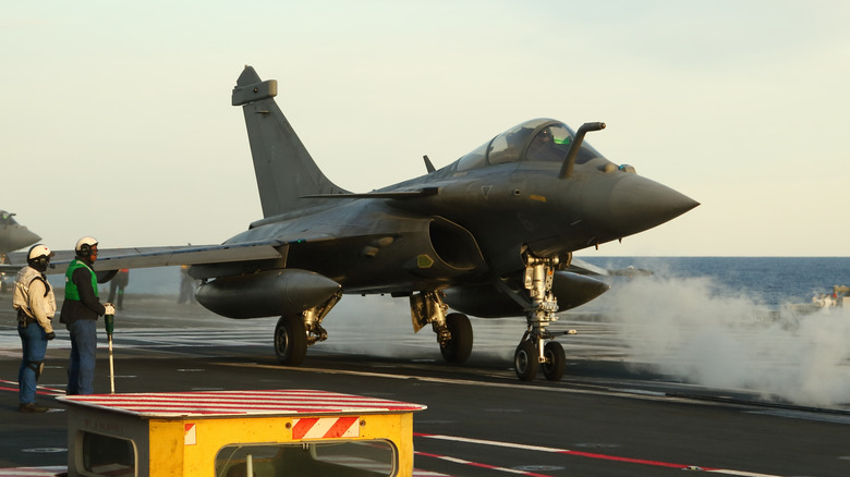 French Rafale fighter on deck of aircraft carrier