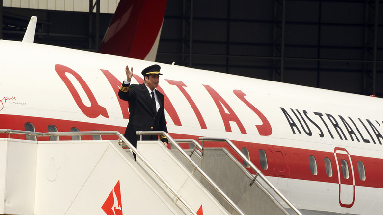 John Travolta exiting his Qantas Boeing 707 in pilots's uniform